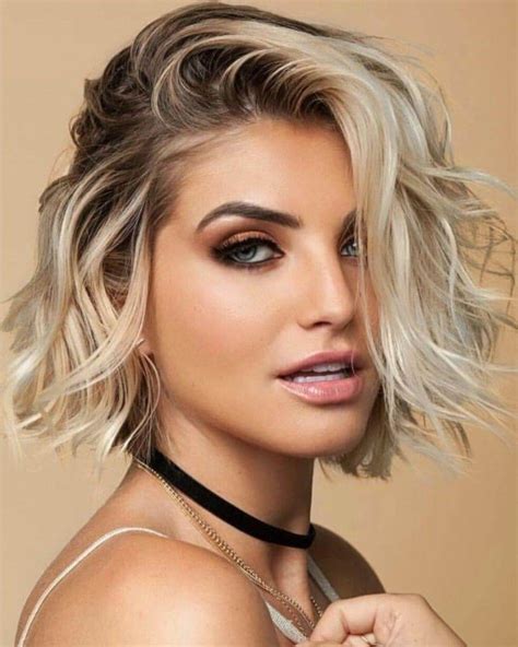 Best short haircuts - 7. Super Short Pixie with Elongated Bangs. Create a bold, eye-catching look with an edgy low-maintenance haircut like this. The elongated bangs swept to the side make the look chic and trendy, while also helping to conceal a high forehead or lines and flattering most face shapes. @hairpin_me_down85.